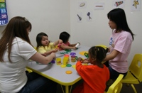 Miss Tracy teaching a 12-36mos old class about animals in Mandarin